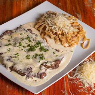 Escalope de ternera con fetuccini a los cuatro quesos