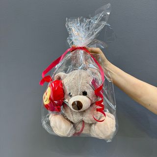 Peluche ( oso P. ) color lechoso 