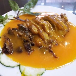 Pato asado con salsa naranja