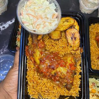 Special jollof rice , chicken , plantain and salad 