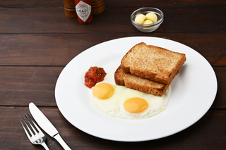 Two eggs with toast and sausage
