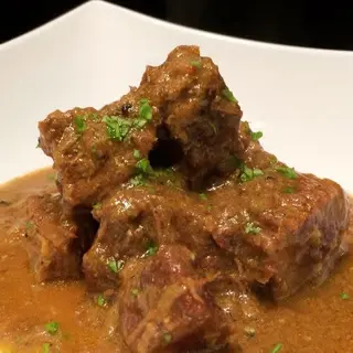 51. Vedella Amb Curry