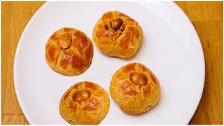 Baked soft pastry dipped in thick syrup