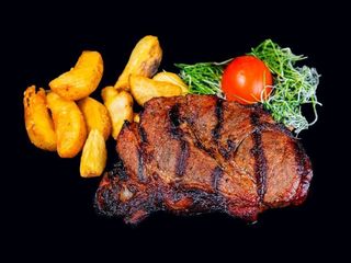 Стейк зі свинини.