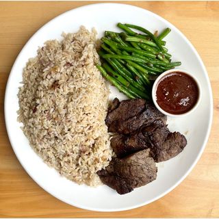 Grilled Beef Medallion with bundled French beans, and red wine sauce 