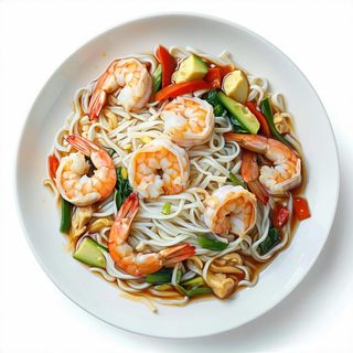 Spaghetti di riso saltati con gamberi e verdure