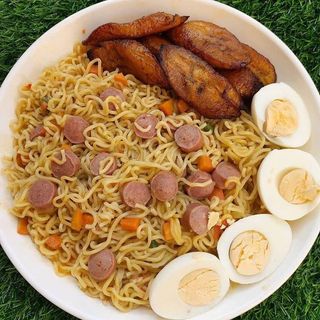 Noodles With Eggs,Sausages,Fried Plantain,And Vegetables