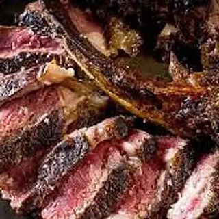 Tagliata di angus 900 g, con rucola, pomodoro ciliegino e scaglie