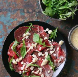 Carpaccio De Carne De Rubia Gallega Con Parmesano