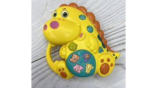 Музыкальная развивающая игрушка Динозавр желтый
