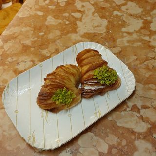 aragostine alla crema con granella di pistacchio