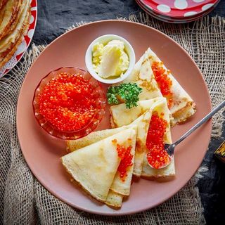 Pancake with red caviar
