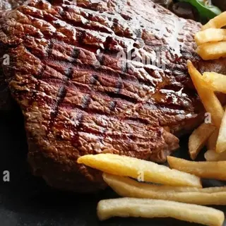 Bistecca di manzo + coca+ patatine 