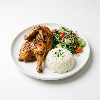 Mezzo pollo con insalata e riso