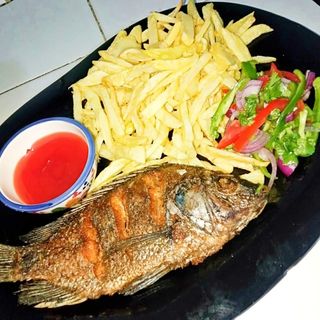 Fish(tilapia)deep fried with chips and kachumbari