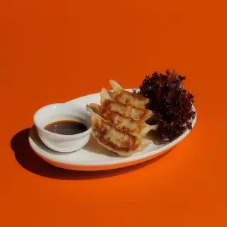 Gyoza De Mariscos Y Cebollino