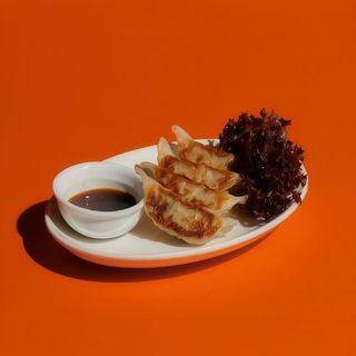 Gyoza De Mariscos Y Cebollino