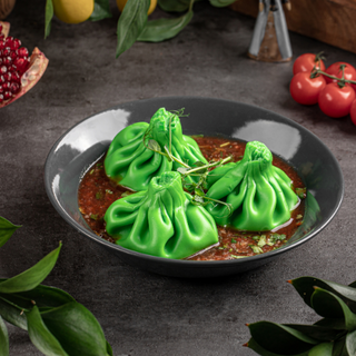 Хинкали с телятиной в соусе ткемали с грузинскими специями