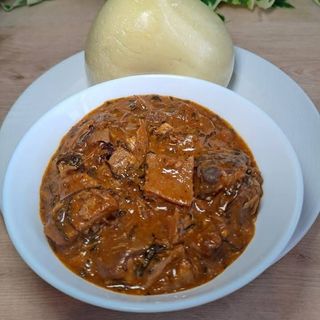 Ogbono mixed with Assorted beef served with semo