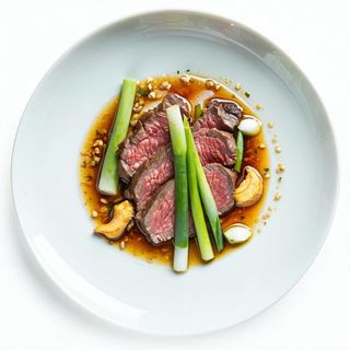 Vitello con cipollotti e zenzero