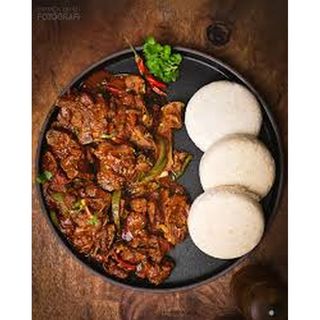 Dry Fried Goat's Meat With Posho & Vegetables