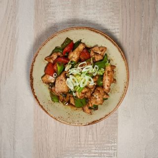 Solomillo en wok con cebolleta