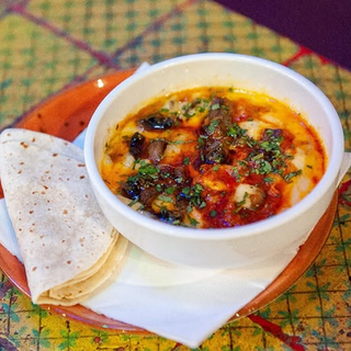 Quesos fundidos chori champi queso y cilantro picado