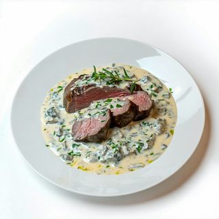 Muschi de vita in sos gorgonzola