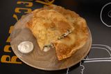 Cheburek with chicken and cheese.