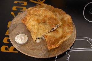 Cheburek with chicken and cheese.