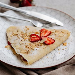 Crepe with berries,white chocolate and almonds