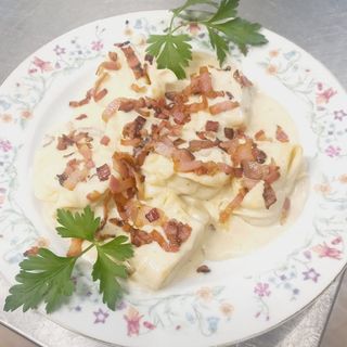 Tortelloni crema di parmigiano con becon