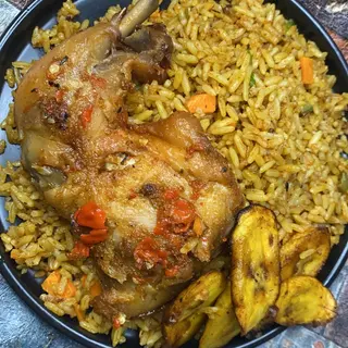 Party jollof serve with medium chicken, plantain