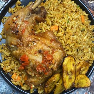 Party jollof serve with medium chicken, plantain 