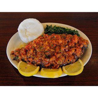 Fish whole in coconut Sauce ugali & green