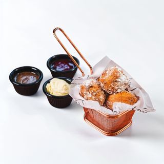 Hot Donuts with Vanilla Cream, Raspberry Sauce & Chocolate Sauce