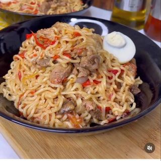 Nigerian noodles mixed with pomo served with 2 boiled eggs