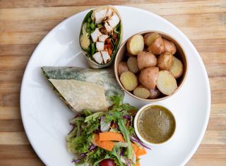 Grilled Chicken and Cheese Burrito with garlic potatoes, garden salad and honey mustard dressing