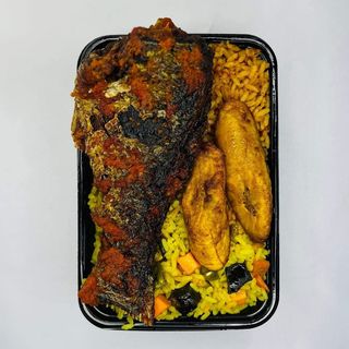 A Plate Of Rice With Croaker