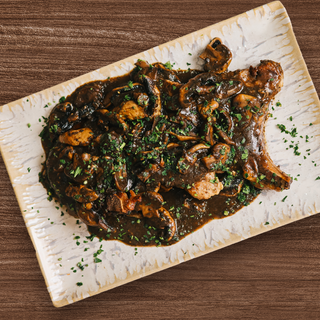 Escalopes con champiñones  en ración