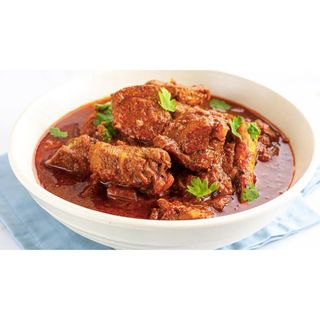 Spiced mutton curry served with naan bread + soda 500ml