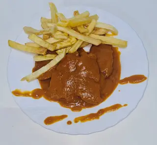 Secreto de cerdo con salsa
