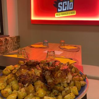 Mezzo pollo allo spiedo con patate
