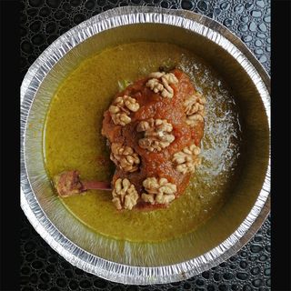 Tagine de poulet,potiron confit et noix