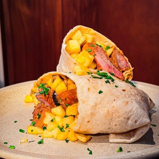 Carne de porco alentejana in a wrap