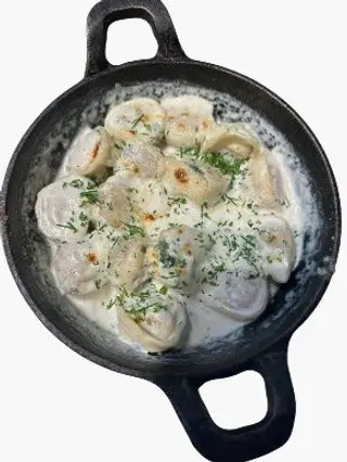 Пельмени запеченные в сливочном соусе (300г)