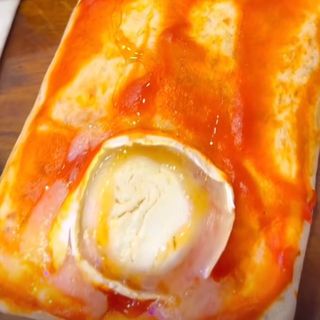 XL gratinado con queso de cabra y miel