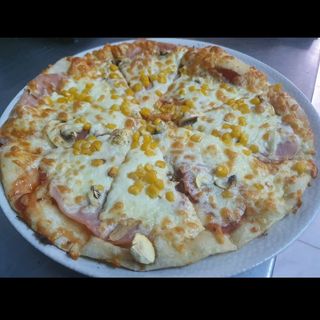 Pizza prosciuto y funghi