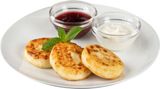 Syrniki with jam and sour cream