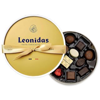 Dora златна кутия с шоколадови бонбони Leonidas (24бр)